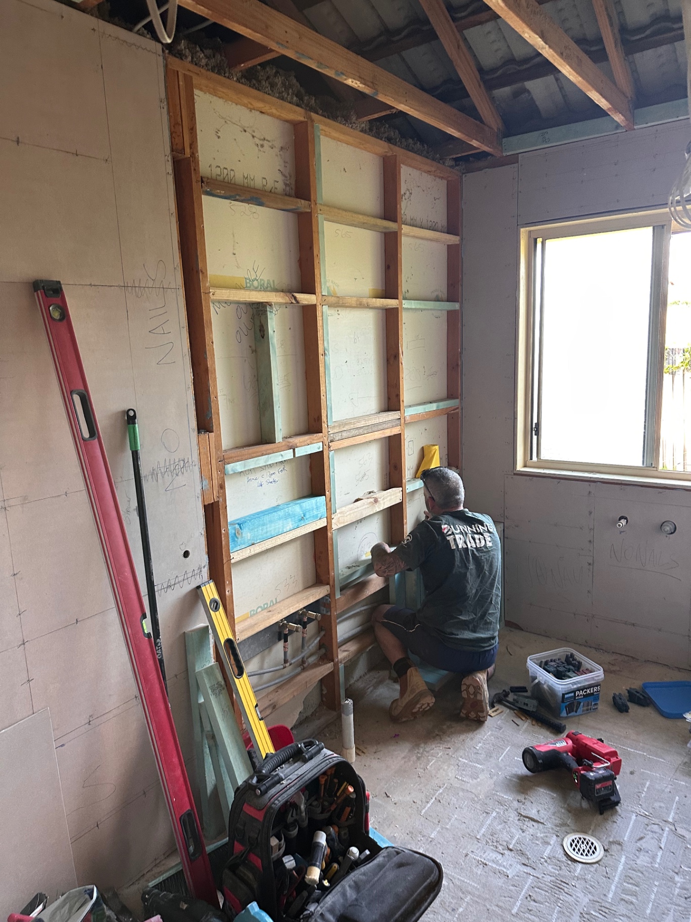 Our team working on timber framing during an interior fit-out